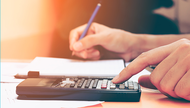 Person calculating bills
